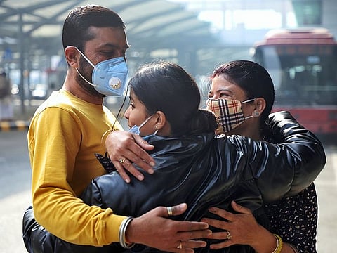 An Indian student meets with her family members on her return from Ukraine at Indira Gandhi International Airport, in New Delhi, on Thursday.