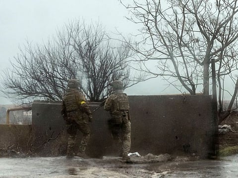 Service members of the Ukrainian armed forces take position near the port of Mariupol, after Russian President Vladimir Putin authorised a military operation in eastern Ukraine, in Mariupol, February 24, 2022.