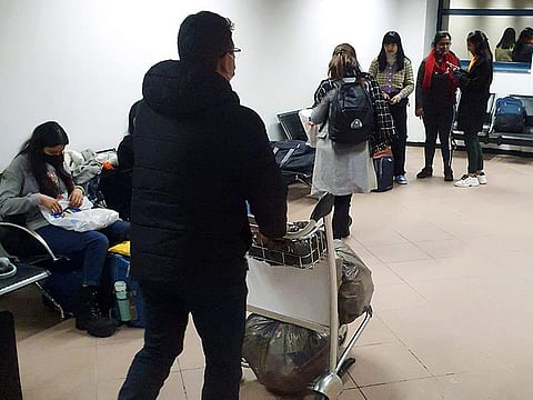 Indian students at Bucharest airport before boarding a flight to New Delhi.