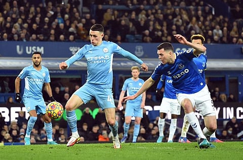 Manchester City's Phil Foden scores against Everton at Goodison Park in the Premier League clash.