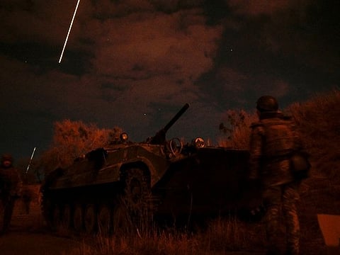 Ukrainian servicemen take positions at the military airbase Vasylkiv in the Kyiv region, Ukraine.