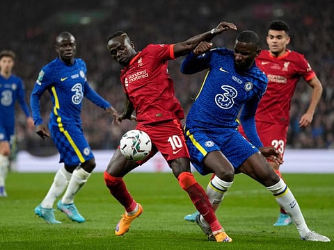 Liverpool's Sadio Mane vies for the ball with Chelsea's Antonio Rudiger during the English League Cup final at Wembley stadium in London.