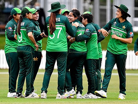 Pakistan's Fatima Sana is congratulated by her teammates after dismissal of New Zealand's Sophie Devine