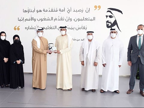 Key officials of the Mohammed bin Rashid Global Centre for Endowment Consultancy and Ajman University at the ceremony to grant the Dubai Endowment Sign.