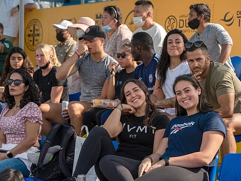 Spectators watch the Throwdown at the Sports, Fitness and Wellbeing Hub, at Expo 2020 Dubai. From Friday, wearing masks outdoors has been made optional, signalling a move towards normality.