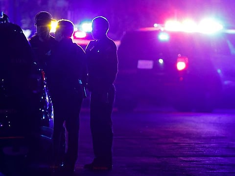 Police officers stand near the scene of a shooting at a church in Sacramento, California, U.S., February 28, 2022.