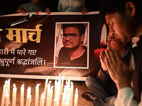 Activists of the India's Youth Congress offer prayers for the Indian student who was killed in shelling in Ukraine, during a candle march in New Delhi on March 1, 2022.