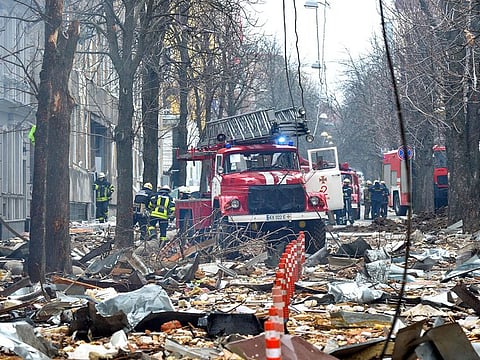 Firefighters work to contain a fire in the complex of buildings housing the Kharkiv regional SBU security service and the regional police, allegedly hit during recent shelling by Russia, in Kharkiv.