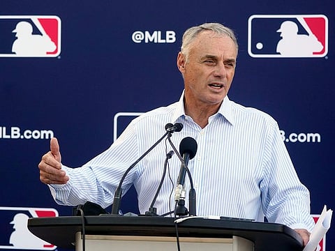 Major League Baseball Commissioner Rob Manfred speaks during a news conference after negotiations with the players’ association toward a labor deal, Tuesday, March 1, 2022, at Roger Dean Stadium in Jupiter, Fla. Manfred said he is canceling the first two series of the season that was set to begin March 31, dropping the schedule from 162 games to likely 156 games at most. Manfred said the league and union have not made plans for future negotiations. Players won’t be paid for missed games.