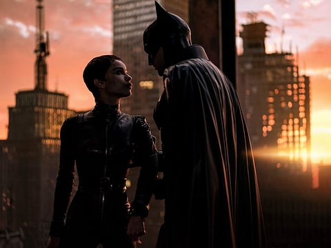Zoe Kravitz, left, and Robert Pattinson in a scene from "The Batman."