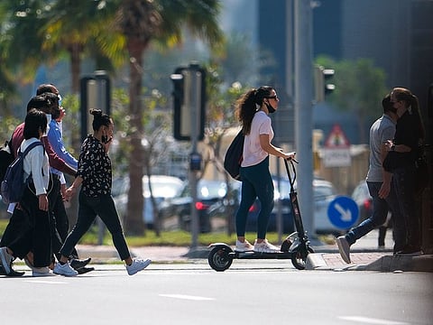 People outdoors without wearing masks in Dubai in line with latest easing of COVID-19 measures