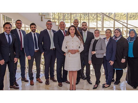 Hanan Nagi, Founder and CEO, Human Network International, with her team