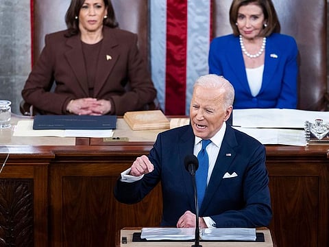 President Joe Biden delivers his first State of the Union address to a joint session of Congress at the Capitol, Tuesday, March 1, 2022, in Washington as Vice President Kamala Harris and House speaker Nancy Pelosi of California., look on.