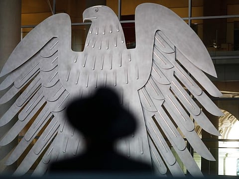 A Rabbi sits in front of Germany's heraldic Eagle as he attends a special meeting of the German Parliament Bundestag in Berlin, Germany, commemorating the victims of the Holocaust on the International Holocaust Remembrance Day, January 27, 2021.