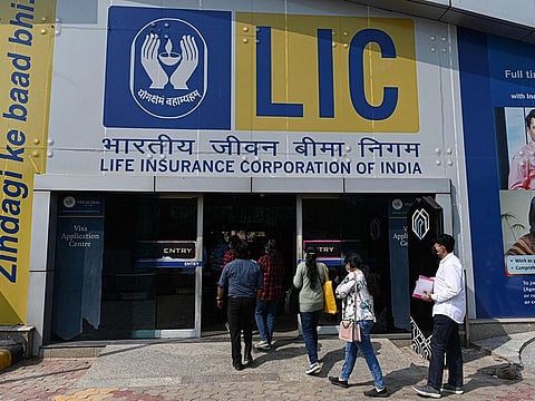 An advertisement of the state-owned insurance group and investment company Life Insurance Corporation (LIC) is pictured at the entrance of a metro station in New Delhi on March 1, 2022.