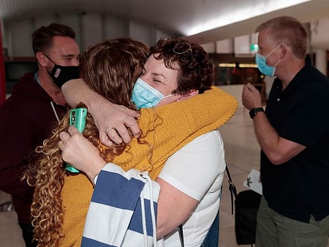 Passengers arrive at Perth Domestic Airport in Perth, on March 3, 2022. West Australian Premier Mark McGowan announced the state will reopen its borders from 12.01am Thursday. The border opening will allow for safe travel into WA from interstate and overseas with vaccination and testing requirements on arrival.