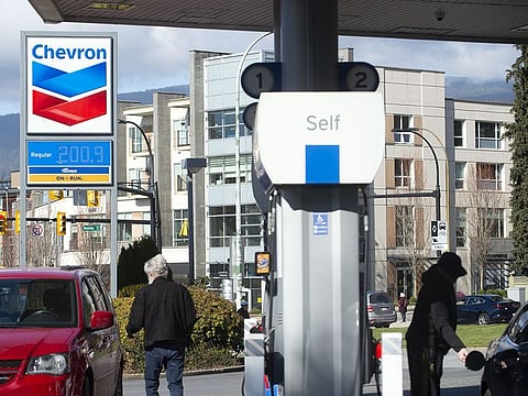 Motorists refuel at a gas station with prices above $2 a litre in North Vancouver, British Columbia, Canada, on Friday, March 4, 2022.