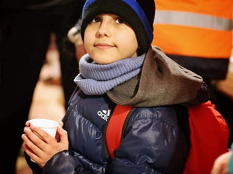 He came all alone because his parents had to stay in Ukraine. Volunteers took care of him, took him to a warm place and gave him food and drink."