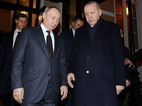 Russian President Vladimir Putin and Turkish President Tayyip Erdogan leave after their joint news conference following the talks in Moscow on March 5, 2020.