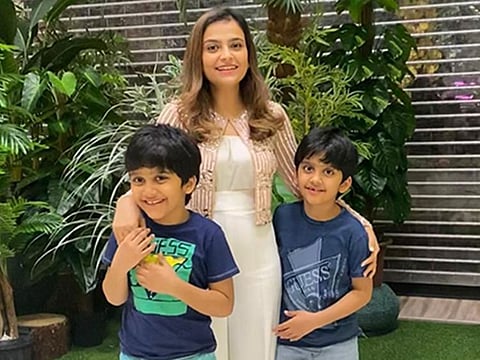 Ambreen with her twin eight-year-olds.