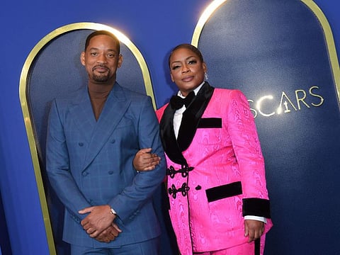 US actor Will Smith and US actress Aunjanue Ellis arrive for the 94th Annual Oscars Nominees Luncheon at the Fairmont Century Plaza Hotel in Los Angeles, March 7, 2022.