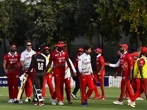 Oman team celebrate their eight-run win over UAE in a close contest in the ICC Men's Cricket World Cup League 2 at the ICC Academy grounds on Wednesday.