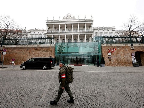 A member of the Austrian armed forces walks past Palais Coburg, the site of a meeting of the Joint Comprehensive Plan of Action (JCPOA), in Vienna, Austria, February 8, 2022.
