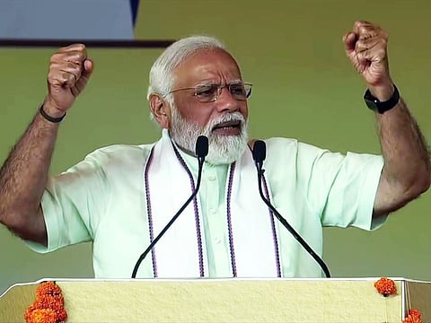 Prime Minister Narendra Modi addresses the Panchayat Maha Sammelan, at GMDC ground, in Ahmedabad on Friday, Mar 11, 2022.