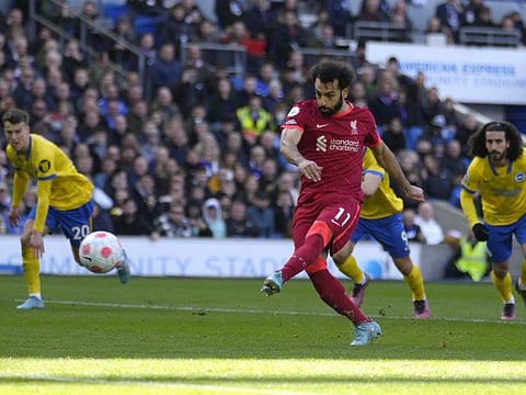 Liverpool's Mohamed Salah scores his side's second goal against Brighton and Hove Albion at the Amex stadium in Brighton, England.
