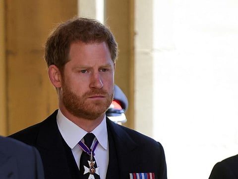 Britain's Prince Harry looks on as he attends the funeral of Prince Philip, husband of Queen Elizabeth, who died at the age of 99, in Windsor, Britain, April 17, 2021.
