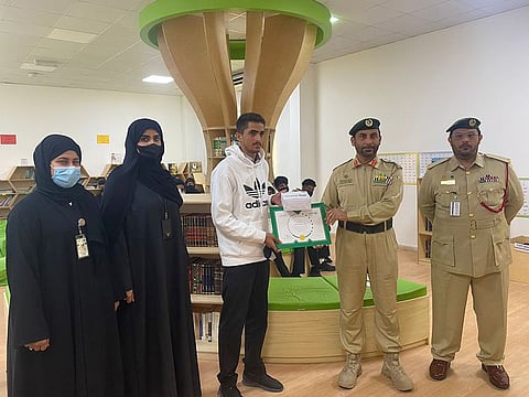 Azam Khalid Dhif Allah (centre) found the wallet at Lulu Village shopping centre in Dubai