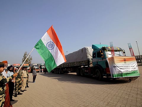 Punjab Frontier Border Security Force (BSF) new Commandant Pradeep Kumar flags off the fourth convoy of trucks carrying 2000 tonnes of wheat to Afghanistan, as part of humanitarian aid from India, at the Attari-Wagah border on Tuesday.