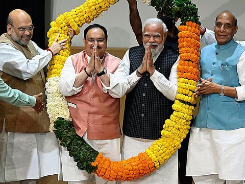 India's Prime Minister Narendra Modi and Bharatiya Janata Party National President JP Nadda being felicitated by Union Ministers Amit Shah and Rajnath Singh in New Delhi