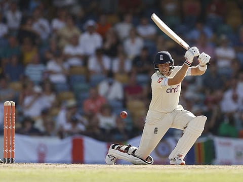 England skipper Joe Root plays his trademark cover drive off pacer Kemar Roach during his unbeaten 119 on the first day of the second Test against West Indies at The Kensington Oval, Bridgetown, Barbados on Wednesday.