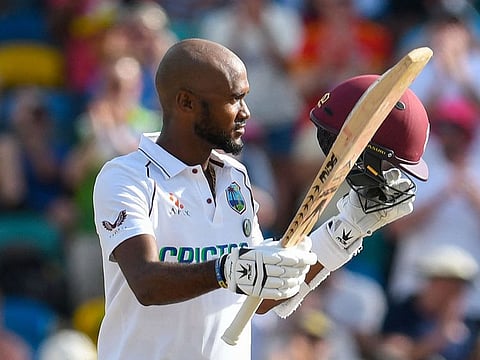 West Indies Test captain Kraig Brathwaite acknowledges cheers from the crowd after reaching a defiant century.
