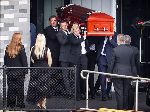 The coffin of Australian cricket superstar Shane Warne is carried by his son Jackson (centre) and others after a private memorial service at the St Kilda Football Club in Melbourne.