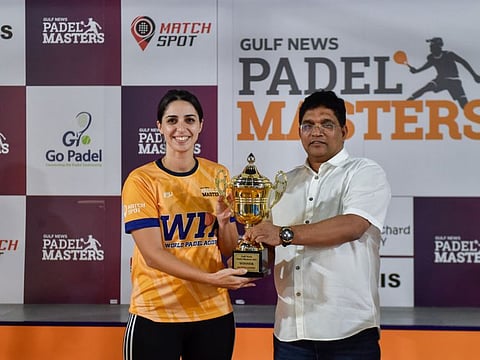 Kalandoor handing over the mixed doubles trophy to Soukaina Mokhtari, who partnered Salim Mokhtari to give WPA, Al Qouz the title in the Gulf News Padel Masters at World Padel Academy on Saturday.