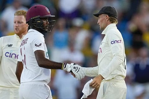 England's captain Joe Root (right) shakes hands with West Indies' captain Kraigg Brathwaite at the end of day five of their second cricket Test match at the Kensington Oval in Bridgetown, Barbados. The match ended in a draw.