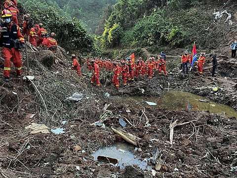 Rescuers conduct search operations at the site of a plane crash in Tengxian County in southern China's Guangxi Zhuang Autonomous Region, on March 22, 2022.