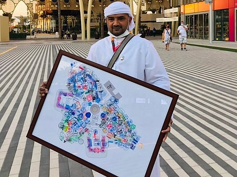 Muhammad Asim Durrani has collected stamps from across the Expo's pavilions on a map of Expo 2020 Dubai.