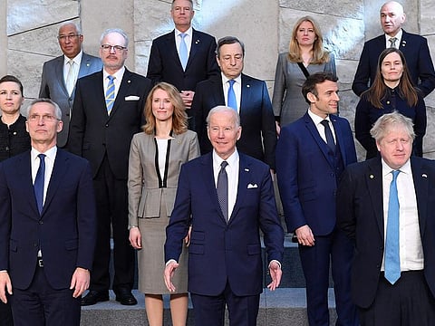 (First rank, from R) Britain's Prime Minister Boris Johnson, US President Joe Biden, NATO Secretary General Jens Stoltenberg with the leaders of the US-led military alliance pose for a family photo at NATO Headquarters in Brussels on March 24, 2022.