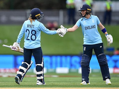 England's Danni Wyatt (left) is congratulated by team captain Heather Knight after she scoring a half-century during the Women's Cricket World Cup match against Pakistan at Hagley Oval in Christchurch.