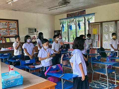 Filipino grade school pupils attend a limited in-person class at a public school for the first time this week after the pandemic lockdown