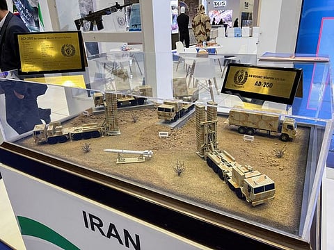 Air defence weapon system models are displayed at the Doha International Maritime Defence Exhibition and Conference in Qatar.