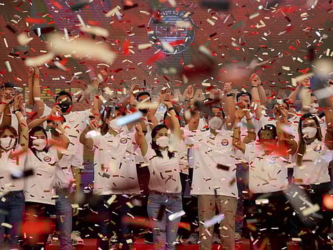 Confetti drops as Quezon City Mayor Joy Belmonte, centre, and her party launche their campaign in Quezon City, Philippines on Friday, March 25, 2022.