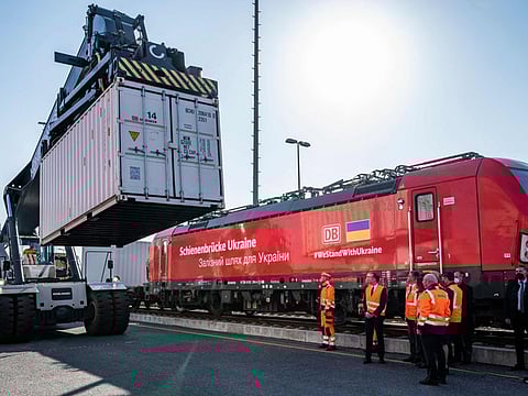 A container is loaded onto a special train bringing aid supplies to the Ukraine, at the BEHALA container terminal in Berlin on March 24, 2022.