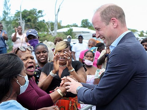 Britain's Prince William shakes hands with a member of the public during a visit to a Fish Fry - a quintessentially Bahamian culinary gathering place which is found on every island in the Bahamas, on Great Abaco island, March 26, 2022.