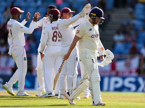 England's Jonny Bairstow leaves the field after losing his wicket during day three of the third Test cricket match against West Indies at the National Cricket Stadium in St. George, Grenada.