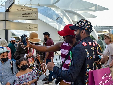 Aazam Tahir Gandhi (in black jacket), is dubbed ‘No.1 fan’ of Expo 2020 Dubai. Having flown in from India just to take part in the Expo, he has become a celebrity in his own right with other visitors taking selfies with him. He says his biggest takeaway from the event is his memories with people from around the world.