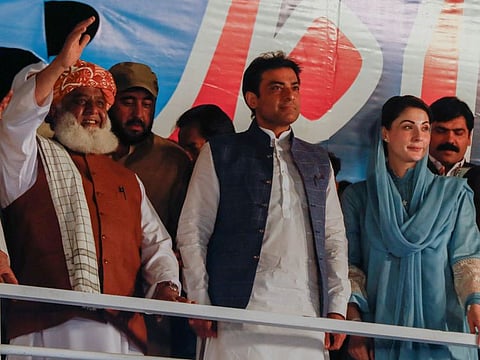 Leaders of the opposition parties Fazal-ur Rehman, president of the Jamiat Ulema-e-Islam-Fazal (JUI-F), Mian Mohammed Hamza Shehbaz Sharif, the son of Mian Mohammed Shehbaz Sharif and Maryam Nawaz, the daughter of Pakistan's former Prime Minister Nawaz Sharif, attend an anti-government rally organised by the Pakistan Democratic Movement (PDM), an alliance of political opposition parties, after the parliament took up a no-confidence motion moved by opposition lawmakers in a bid to remove Prime Minister Imran Khan.